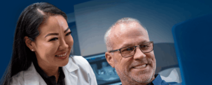 Dentist discussing dental care with a smiling patient